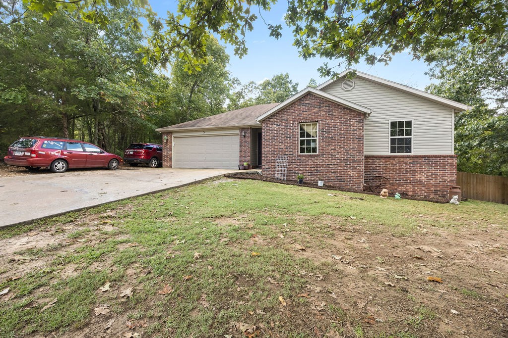 Completely updated 1,308 sq ft home featuring 3 bedrooms and 2 bathrooms. Enjoy brand-new flooring, fresh paint throughout, and recent upgrades including a new roof, hot water heater, and spacious deck—perfect for outdoor living. Located in the scenic community of Bella Vista with easy access to trails, lakes, and amenities. A turnkey property you won’t want to miss!