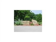 4.47 Acre lot in the an exclusive gated community with lake access, picnic area, possible boat slip available from H.O.A. Mature trees. It's time to build your dream home.