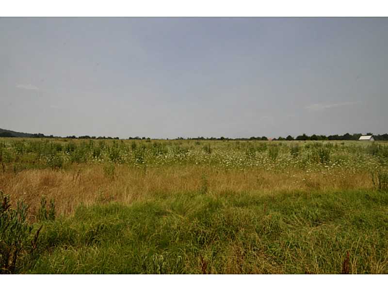 6 acres with a pond and frontage to HWY 45. This is a great building site and excellent for horses or cows. In the Fayetteville school district and additional land is available! Public water, gas, electric. Needs septic