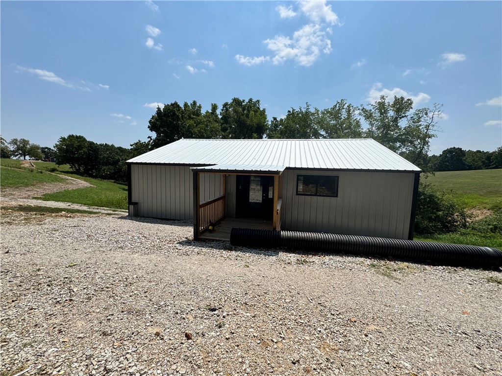 Charming 1 bedroom, 1 bathroom barnalulium home in Omaha, AR. Newly surveyed and remodeled with water and septic in place. Electrical connection available at the street will be connected prior to sale, 2 New Mini splits will be installed as well. Ideal as a starter home, Airbnb, or vacation retreat. Conveniently located 20 mins from Branson, MO, and within 10 mins of Table Rock Lake, Cricket Creek Marina, Tucker Hollow, and Bull Shoals Lake. Sold AS IS, this property offers a great opportunity for those seeking a cozy and accessible dwelling near multiple recreational sites.