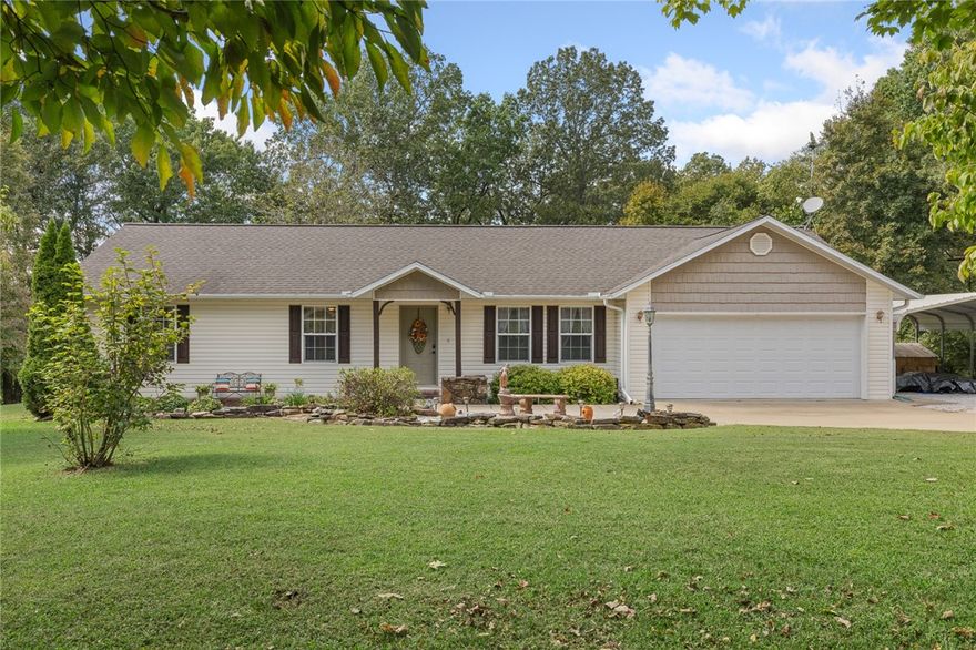 Beautiful 3-bed, 2-bath home sitting on 1 acre in the highly sought-after Ridgeway subdivision just North of town. This open-concept layout features hardwood floors, granite countertops, and plenty of natural light. Enjoy the park-like setting from the large covered porch. Property includes multiple outbuildings and a spacious two-car garage—perfect blend of comfort, convenience, and country charm.