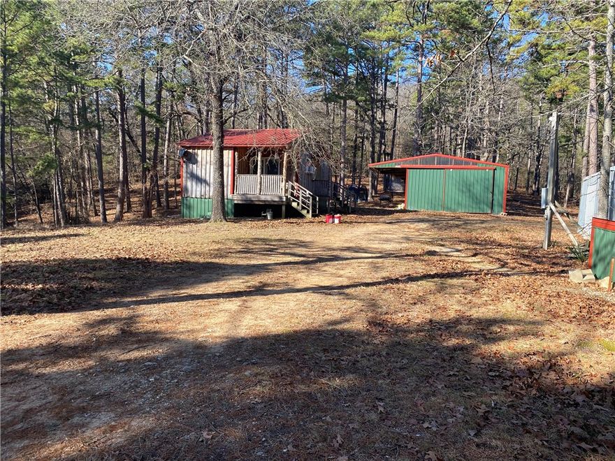 Tucked away in the Ozark Hills, this cedar-sided, two-bedroom, one-bathroom cabin sits on 40 acres. The land is approximately 10 acres open and 30 acres wooded, making it an ideal weekend getaway or hunting retreat in the Omaha area. All appliances and furnishings are included, with the exception of one bed and the gun safe. The property also features a washer and dryer, a double metal garage, a metal storage building, and an abundance of mature hardwoods. Access trails are plentiful not far from Branson, MO and Bull Shoals Lake.