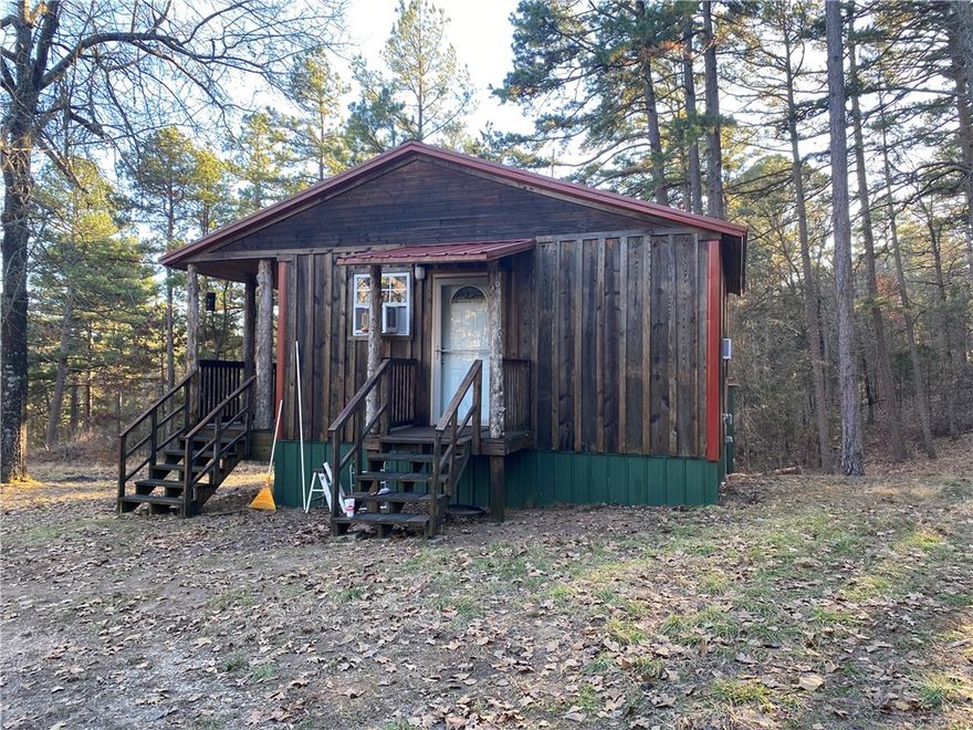 Tucked away in the Ozark Hills, this cedar-sided, two-bedroom, one-bathroom cabin sits on 40 acres. The land is approximately 10 acres open and 30 acres wooded, making it an ideal weekend getaway or hunting retreat in the Omaha area. All appliances and furnishings are included, with the exception of one bed and the gun safe. The property also features a washer and dryer, a double metal garage, a metal storage building, and an abundance of mature hardwoods. Access trails are plentiful not far from Branson, MO and Bull Shoals Lake.