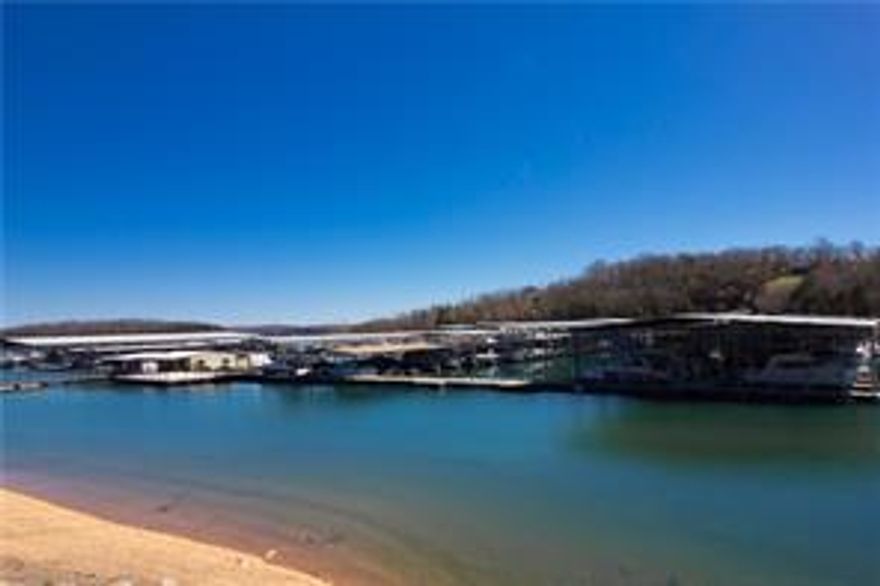 Looking for affordable, buildable acreage that's near Beaver Lake?  Look no further!  This 1.32 acres is on two lots in a quiet & serene setting that is only 1.5 miles from Rocky Branch Marina & park.  Many hiking & biking trails are nearby in Hobbs State Park for the outdoor enthusiast.  Downtown Rogers is only 13 miles away, a short trip to the grocery store or to the Downtown Rogers Entertainment District.  Water & electric are at street.