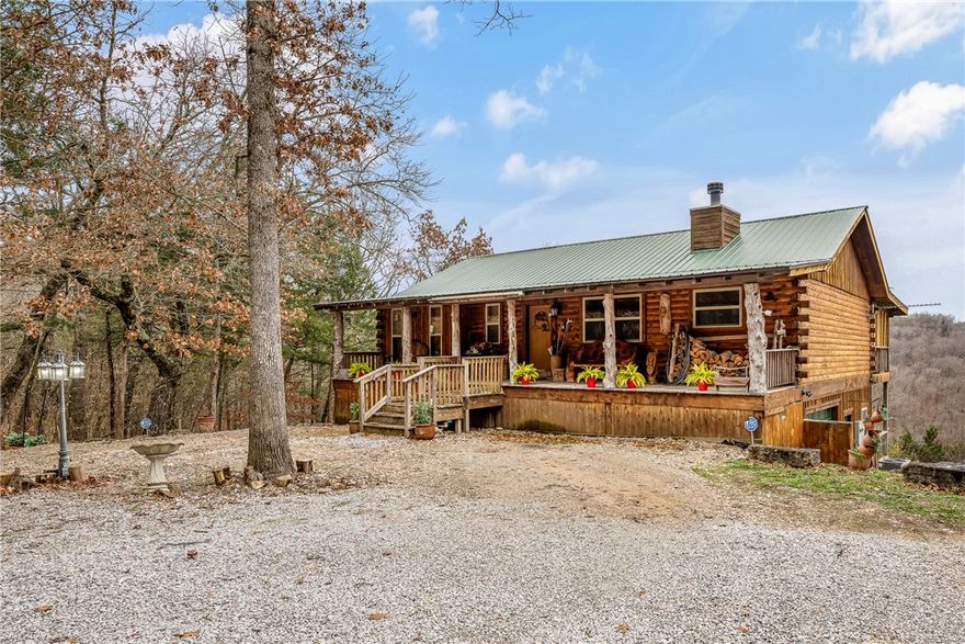 Stunning ~2.88-acre luxury estate with sweeping views of Inspiration Point and the White River, just minutes from Eureka Springs. This exceptional custom all-wood residence, showcases timeless craftsmanship with rich wood floors, solid wood cabinetry, and beautifully finished wood walls and ceilings throughout. The main home offers 3 bedrooms, 2.5 baths, a dedicated office, bonus room, and expansive windows that frame the breathtaking landscape, along with dual decks designed for elevated outdoor living. A separate 720 sq ft guest cabin/ADU is fully furnished and operates as a successful active short-term rental with bookings into 2026, delivering immediate income potential. Perfect as a private retreat, family compound, or luxury investment, this rare offering includes a hot tub, kitchen refrigerator, washer and dryer, whole-home propane generator, Starlink, and security system, all in a serene, private setting.
