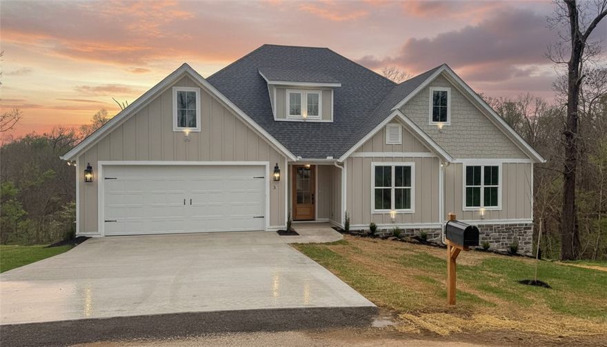 Nestled on a serene 0.47-acre wooded lot, this impressive 5-bedroom, 3-bath home captivates with its vaulted entryway and spacious living room, designed to bathe the space in natural light and create an airy, welcoming atmosphere. The open layout seamlessly connects the various living areas, making it perfect for both entertaining and everyday comfort. Inside, the home showcases exceptional craftsmanship, featuring custom cabinetry, elegant ceramic tile, and rich hardwood flooring throughout the main living areas. The carpets in the bedrooms provide a cozy touch, enhancing the warmth and comfort of the space. A charming covered patio extends the living area outdoors, offering a shaded retreat ideal for relaxation or entertaining guests. With its private setting and generous lot size, this home is conveniently located near Lake Loch Lomond and Highlands Golf Course, while still being just moments away from shopping, dining, and everyday essentials.