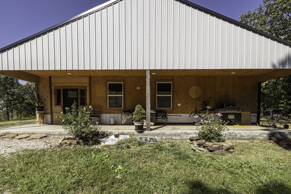 Come see all that this home on 7 acres has to offer! There is 2000 SF of living space that has 2 bedrooms and 2 full bathrooms, the garage is insulated and could be made into an additional bedroom with access to a full bathroom. Open floorplan and tall ceilings give a spacious feel and the windows provide lots of natural light. The kitchen and bathrooms need to be finished and the home needs paint and trim, which gives the new buyer the opportunity to finish the home the way they want. There are 2 shops one is 24X30 ft one is 8X12 ft and there is a cabin that is 16X 24 ft with electric and water and could be hooked up to the septic to finish the plumbing. With lots of wildlife amazing sunset views and close to Beaver Lake and just 30 minutes from Eureka Springs and trails for biking and hiking at nearby state parks this property has something for everyone!