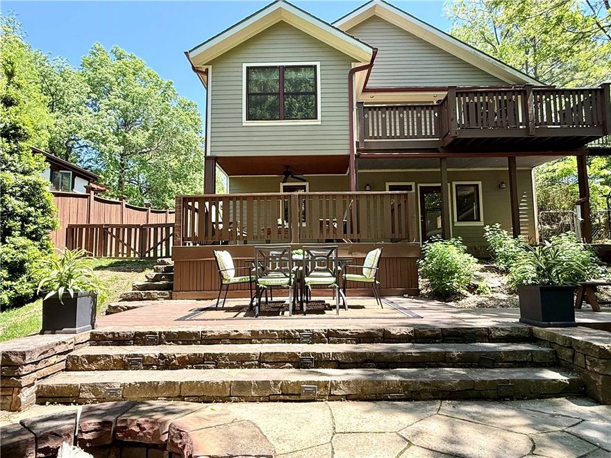 Welcome to your glorious oasis in the heart of Fayetteville!  This very spacious home and property is equal parts relaxing, tranquil, and a private park perfect for entertaining.  More photos coming soon of this delightful Wilson Park home.  Take advantage of your time in Fayetteville and see this home today!  Fully renovated in 2008 from top to bottom, thoughtfully designed to accommodate a variety of occupants and support the lifestyle you desire. With unbeatable walk-and-bike access to all the best of Fayetteville. The main level has airy open living areas and private primary suite with treehouse feel, flowing to a balcony. The flexible downstairs layout has second living or extra guest area and oversized laundry for maximum functionality.  A cute, detached shed adds convenience in place of garage—perfect for bikes or hobby/sport gear. The large, fully fenced backyard features multiple hangout spaces, including stone patio with wood-fired pizza oven. Solar panels fully paid with transferable net-metering permit.