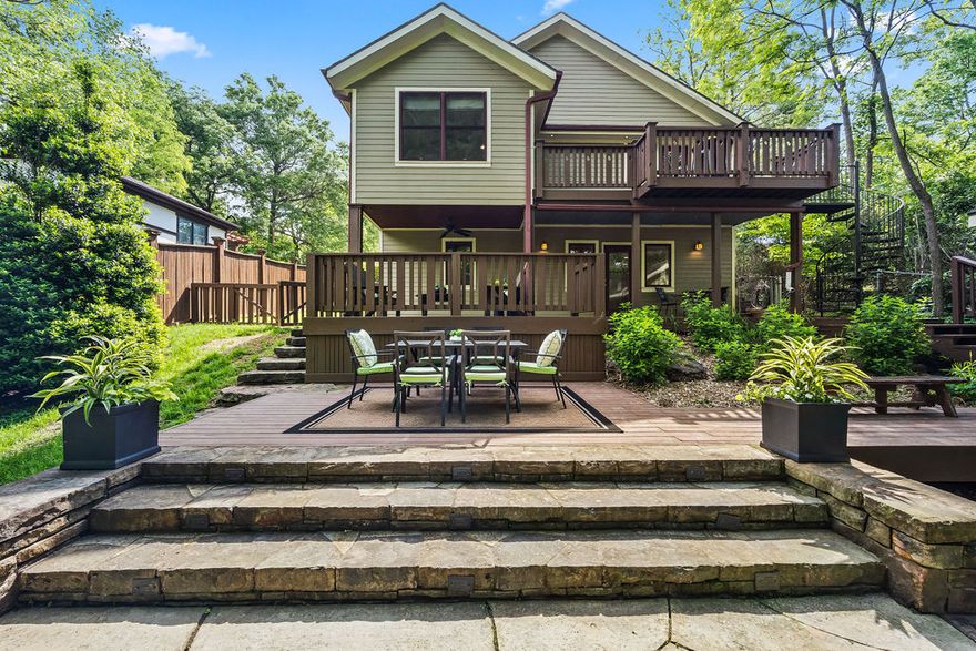 Welcome to your personal sanctuary in the heart of Fayetteville's Wilson Park neighborhood!  This spacious home and property offers room to spread out—perfect for entertaining, unwinding, and recharging after a busy day.  Fully renovated in 2008, with fresh interior paint and refinished hardwood floors in 2026—this home feels like new!  The main level has airy open living areas and private primary suite with treehouse feel, all flowing to a balcony that overlooks the tree canopy and entertaining spaces below. The flexible downstairs layout features a bonus room perfect for second living and extra guests.  We love the oversized laundry and cute, detached shed for meeting a variety of storage needs in place of a garage.  The large, fully fenced backyard features multiple hangout spaces, including stone patio and wood-fired pizza oven that is a joy to use.  From here, you can walk or bike to Fayetteville’s best destinations—yet feel worlds away at home.  Solar panels fully paid with transferable net-metering permit.