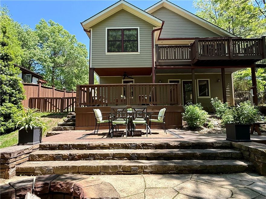 Welcome to your glorious oasis in the heart of Fayetteville!  This very spacious home and property is equal parts relaxing, tranquil, and a private park perfect for entertaining.  More photos coming soon of this delightful Wilson Park home.  Take advantage of your time in Fayetteville and see this home today!  Fully renovated in 2008 from top to bottom, thoughtfully designed to accommodate a variety of occupants and support the lifestyle you desire. With unbeatable walk-and-bike access to all the best of Fayetteville. The main level has airy open living areas and private primary suite with treehouse feel, flowing to a balcony. The flexible downstairs layout has second living or extra guest area and oversized laundry for maximum functionality.  A cute, detached shed adds convenience in place of garage—perfect for bikes or hobby/sport gear. The large, fully fenced backyard features multiple hangout spaces, including stone patio with wood-fired pizza oven. Solar panels fully paid with transferable net-metering permit.