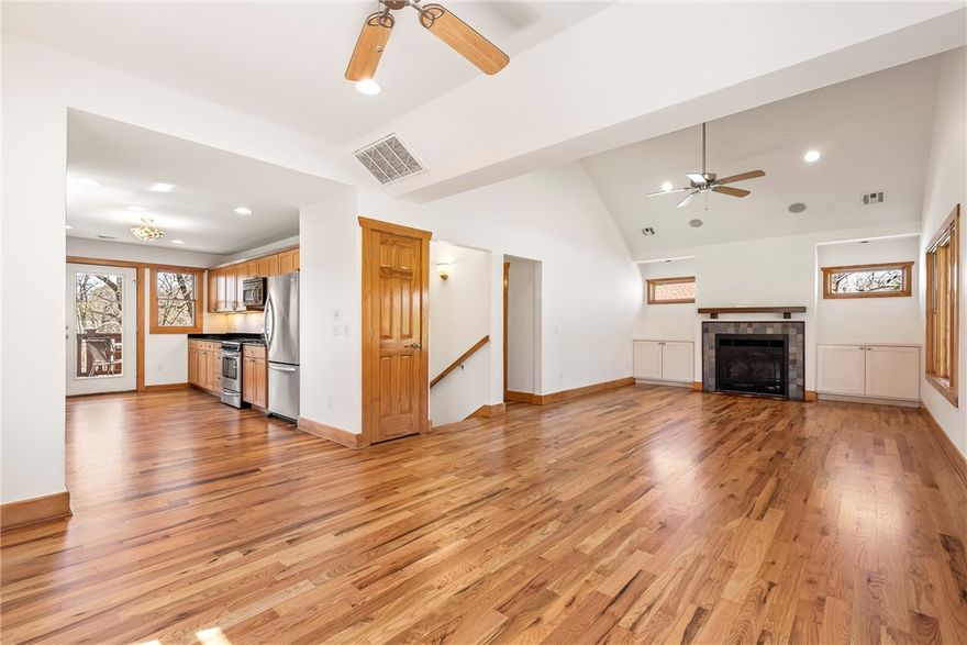 Welcome to turnkey living in the heart of Fayetteville at Wilson Park—this fully renovated, thoughtfully designed home on a larger lot lets you lean into the lifestyle you desire. The home feels like a peaceful sanctuary with welcoming comfort and unbeatable walk-and-bike access to UA, Razorback Greenway, Dickson St, and beyond. The main level lives spaciously with airy open living areas and a private primary suite with a treehouse feel, flowing to a balcony where people naturally linger. The flexible downstairs layout accommodates multiple occupants with a second living area, two bedrooms, an oversized laundry room, and backyard access. A detached storage building adds convenience in place of a garage—perfect for bikes or hobby/sport gear. The large, fully fenced backyard features multiple hangout spaces, including a stone patio with wood-fired pizza oven. Solar panels are fully paid with a transferable net-metering permit. Just minutes to the best of Fayetteville!