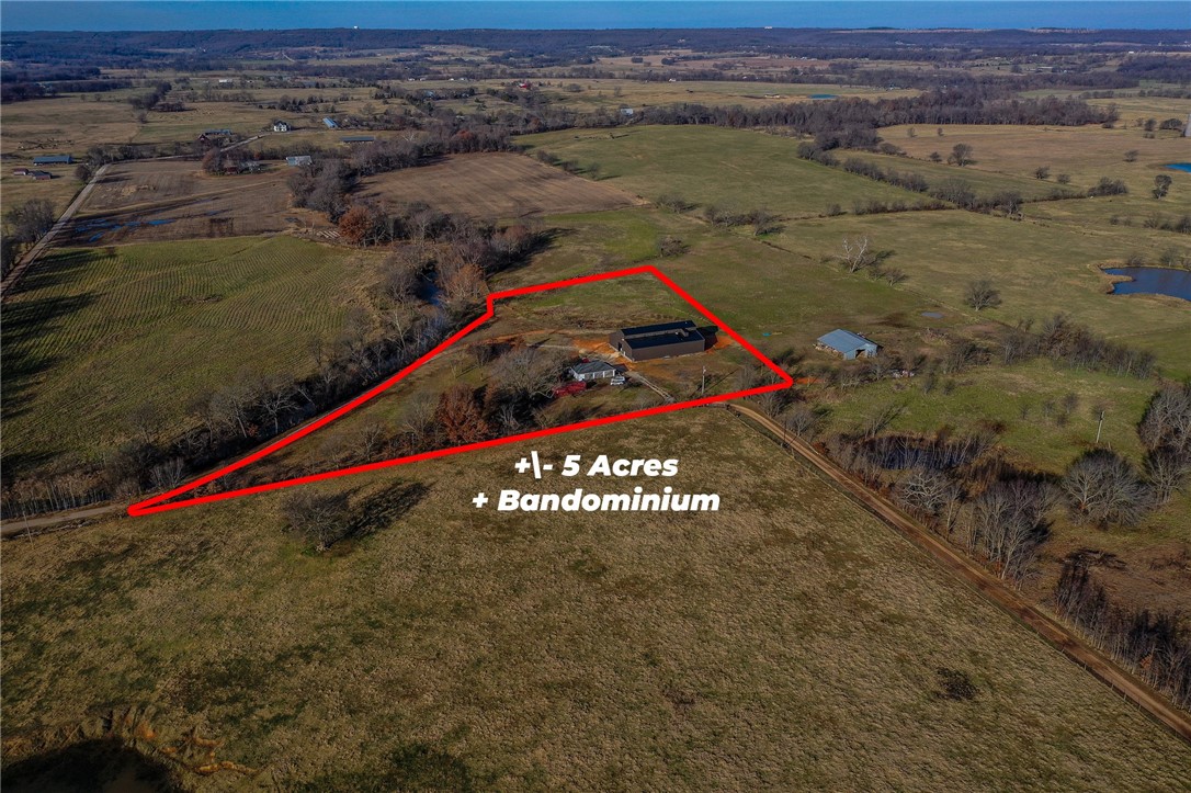 Welcome to this unique 5 acre property. Located along the Muddy Fork River, this custom residence bardominium is 2400 sq ft. With 3 bedroom, 4 baths and bonus room, it has plenty of room for everyone. The lower section is perfect for equipment storage or anything you would want. With water and electric on site and a 3 car detached garage, there is plenty of room for any hobbies. The inside is done and ready to be finished out by the new owner. There is also an additional 17 acres available with this listing.