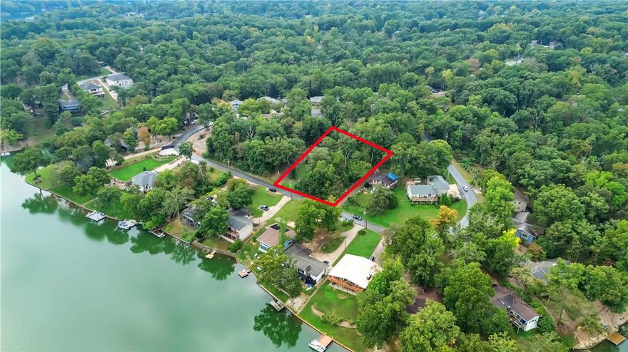 Build your dream home on this exceptional .27-acre lot offering scenic lake views and a peaceful, natural setting. The property features mature trees that provide shade and privacy, with space for construction. Situated in a desirable location with convenient access to nearby amenities, this lot offers the perfect balance of tranquility and accessibility.