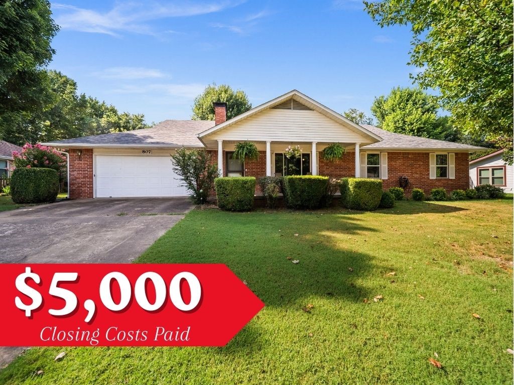 This checks all the boxes- and qualifies for $0 down Rural Development loan AND seller is offering buyer $5,000 towards closing costs! With unbelievable space, this all brick home has not one--but TWO-- huge living rooms! The front living room has a gas fireplace perfect for those chilly winter evenings. The back living room is surrounded by (updated!) windows overlooking the mature landscaping & beautiful blooming flowers. Need more space? This house has it-- a dedicated office space has a built-in cabinet and adjustable shelving. Need even more space? This house has that too-- a 24'x20' HEATED shop with garage door is at the back of the property.Perfect for the hobbyist- or a great potential for an ADU conversion! This well maintained home has newer vinyl windows throughout, new HVAC system in 2024, new roof & gutters in 2024,& updated hot water tank in 2024.The backyard oasis includes a covered patio area, updated privacy fence, professionally trimmed oak tree, & French drain system. Walking distance to schools!
