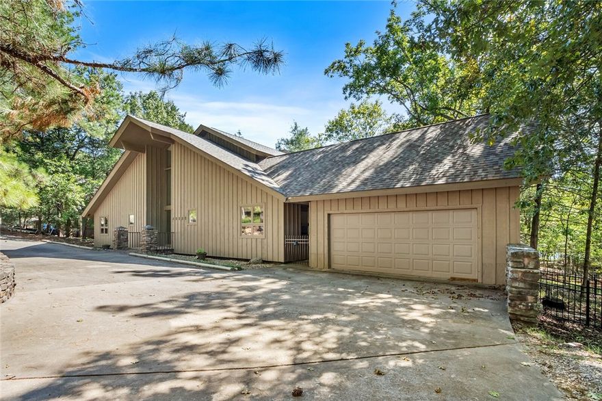 Don't miss this opportunity to own this stunning lakefront home on beautiful Beaver Lake! Great location in the deepest part of Beaver Lake with 4-slip private dock with 3 lifts included; gentle slope with path  to the lake; no wake cove with view of the sail boat club; three bedrooms on main level, and a bunk room that will sleep 8+ people! Slate floors in the kitchen with view into the living room with cathedral ceilings, and  has a beautiful stone fireplace that goes to the ceiling. A wrought iron fence on the back and side of the home for your pups. New roof in July, 2022. Home being sold with most furnishings and including lake toys,  other than owner's personal items. Lockbox located on iron gate between house and garage.