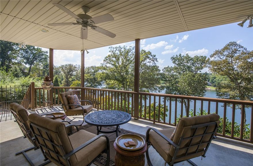 Spectacular lakefront home that will take your breath away! Step into this stunning home and be captivated by the vast view of with expansive windows evoking peace and serenity.  131' of shoreline with boathouse and lift.  Whether on the water or enjoying the view from the multiple living spaces this home has every WOW factor you can imagine.  This pristine home embodies a casual elegance and fantastic floor plan sure to please kitchen and master bath remodel with new bamboo hardwood flooring throughout. Kitchen downstairs perfect for guests or MIL space. Impressive spacious This home was built to enjoy the view from most every room in the house. Includes a boat house.  You're going to LOVE your new life here. Like coming home to a vacation everyday.  Security System does not convey. Corporate Addendum - Buyer's Agent Instructions Must Read and Include Addendum and Specific Clauses that must be included in all Purchase Agreement - See Attached Documents