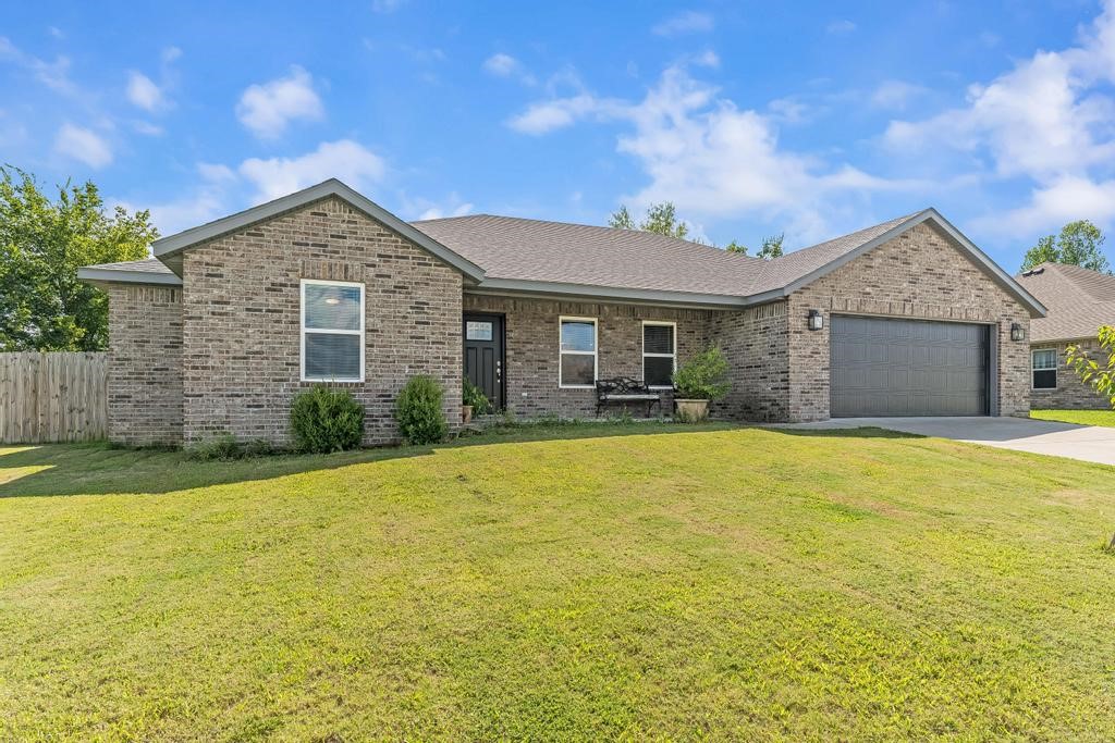 Welcome to 961 Richland Creek Ave in Elkins... a 4-bed, 2-bath, split floor plan home with a full brick exterior and large 2-car garage. The living, dining and kitchen flow as a large open concept great room. The kitchen features granite counter tops, stainless steel appliances, pantry, tons of cabinet space & a large center island with bar seating. The living room has ample space for a large sectional or multiple pieces of furniture. The dining space is right off the kitchen and access to the backyard is conveniently located right between the kitchen and dining space. LVP floors flow throughout the main living space with carpet in the bedrooms. The primary suite has a tray ceiling, dual sink vanity, tub, walk-in shower and a deep walk-in closet. The three secondary bedrooms and the second full bath are located on the opposite side of the house. The level backyard includes a covered patio, garden space and a wood privacy fence.