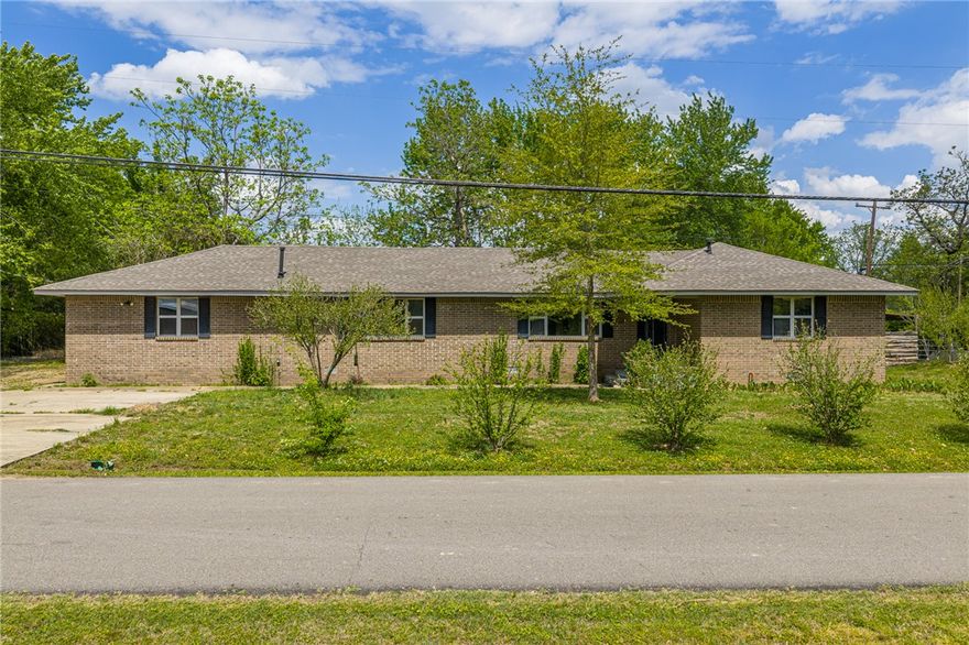Opportunities like this don’t come around often! Whether you’re an investor, flipper, or buyer ready to build instant equity, this property is your chance to act fast. With good bones and bathroom updates already started, much of the groundwork is in place—just bring your vision and finish it out. Offering 4 bedrooms, 3 bathrooms, and 2,437 sq ft on a corner lot, this home features a split floor plan with a huge primary suite. Original hardwood floors are ready to be restored, adding serious value and character. Enjoy a wood-burning insert, gas range, and refrigerator that conveys, plus a screened-in back porch, fenced backyard, and two storage buildings along with a 2 car garage.