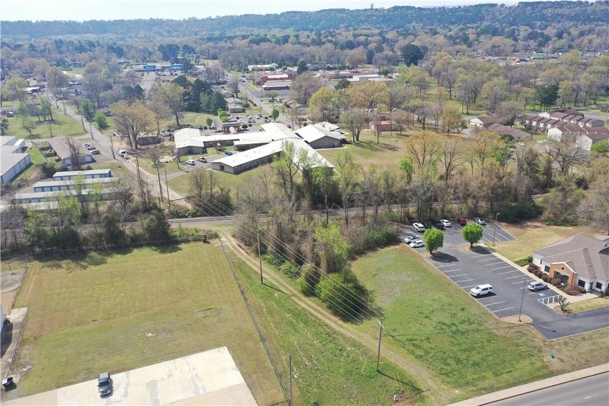 Prime commercial lot strategically located adjacent to the railroad, offering high visibility and excellent accessibility. Situated on a high-traffic road, this property benefits from substantial daily exposure, making it an ideal spot for businesses seeking to attract attention.
Directly across from Russellville Junior High, this lot enjoys proximity to both educational and recreational hubs, including the Bona Dea Trails. With the vibrant downtown entertainment district just minutes away, this location provides a perfect blend of commercial potential and community connectivity. Perfect for retail, hospitality, or other commercial ventures, this lot presents a unique opportunity to capitalize on a high-demand, high-traffic area with substantial future growth potential.