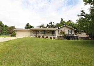 MUST SEE THIS NEWLY REMODELED HOME! New-New-New......New floor coverings, New cabinets, New Counter tops, New appliances. Large (27'X 9'9)covered back deck and Ladies...the neatest little green house ever! Guys..you have the perfect Man Cave! This truly is a wonderful updated, move in ready home! Workshop in basement plus an additional out building provides plenty of room to work on your projects. Nice sized raised garden bed in the back yard. Come see this home!