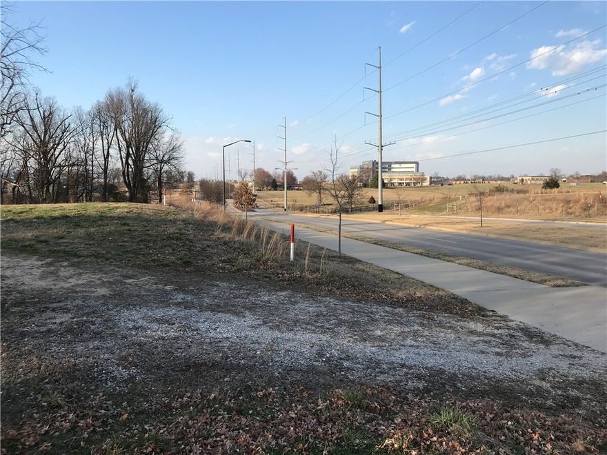 Incredible Development Potential totaling 6.97 acres. Excellent location in NW Arkansas next to Arvest Ballpark. Approximately 621ft of frontage on Gene George Blvd. Multiple possibilities