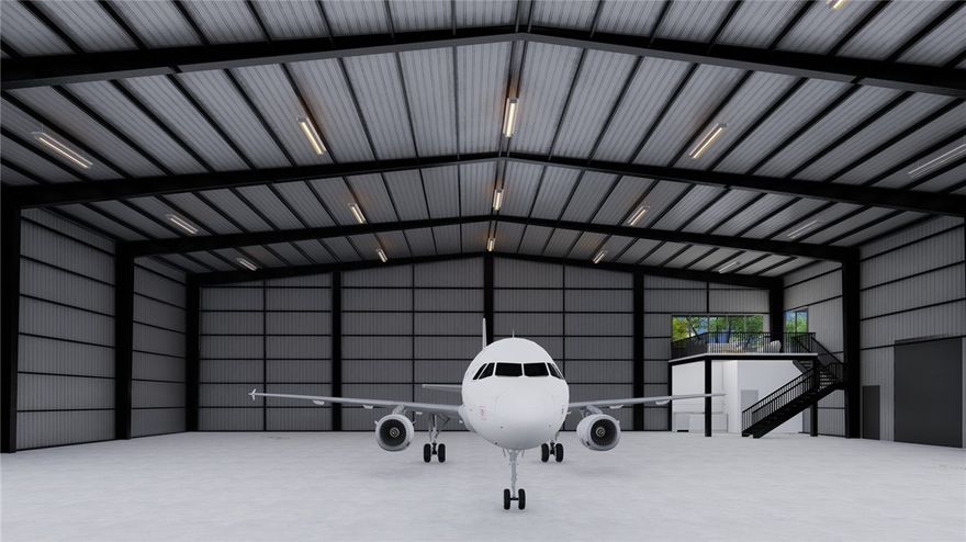 Brand new construction. Check out this new 60' x 60' hangar at the Springdale Airport to be completed December 2025. This hangar is 26' in height with a 20' x 50' Schweiss hydraulic door with remotes. Hangar also includes a kitchenette, bathroom, and mezzanine lounge. Plenty of electrical outlets and high bay LED lighting. Back-up generator. Private parking lot south of building.