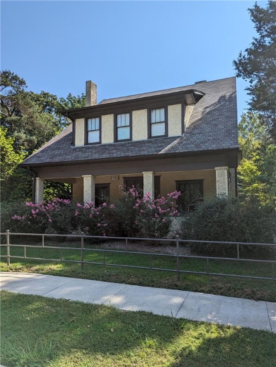 Home is on the National Historic Register and the only Tudor Revival house in Siloam Springs. This historical home is on a secluded lot overlooking Sager Creek and downtown Siloam Springs. The detached garage/carriage house has a 1 bedroom apartment over the garage.