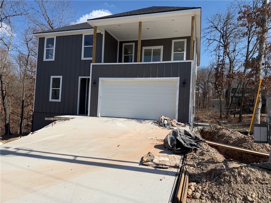 Seller to pay up to $5k towards Buyers Closing Costs & Prepaids AND provide a washer, dryer, and stainless steel refrigerator with full price offer. New construction home in the Bella Vista area. Sodded front yard, seed & straw on the side & backyard. 3 bedrooms / 2.5 baths. Stainless Steel appliances. Kitchen has 2cm quartz and marble backsplash along with a stainless steel gas/propane cooktop and oven, a microvent, and dishwasher. Living room has a gas/propane fireplace with tile surround. Ceiling fans throughout. Primary bedroom has bathroom suite with a separate free-standing tub and tiled oversize shower, dual vanity sinks, and 2 cm quartz countertops. Disc lights, ceiling fans, and 2” faux wood blinds throughout the home. Spacious 2 car garage. 

Owner is related to a realtor. Owner is related to the builder. Builder is a licensed real estate agent with Grandview Realty, LLC. Taxes are based on the land only and will increase when re-assessed.