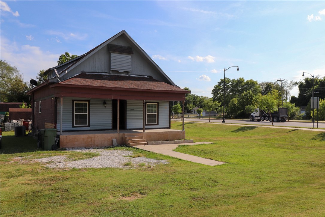 Fixer Upper at the heart of Rogers. Big lot .48 acres with a big potential to make your dream home.