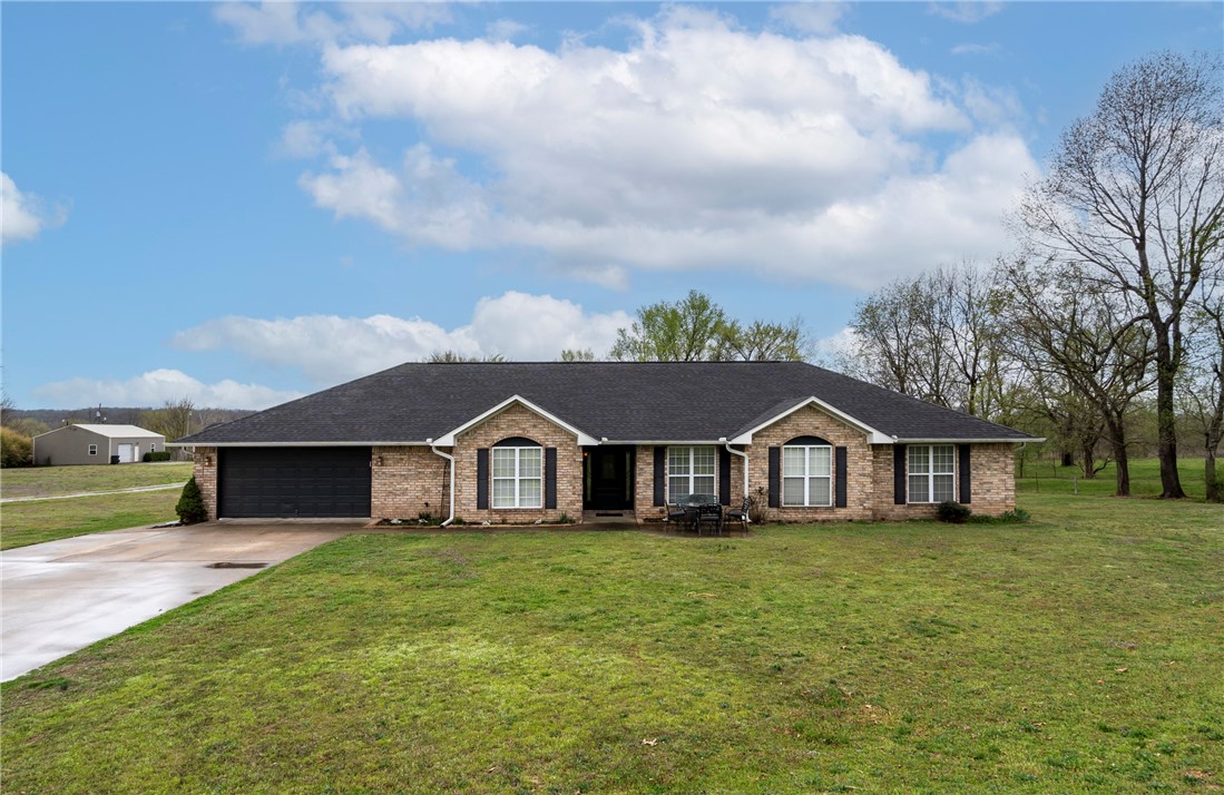 Beautiful 4br/3ba brick home w/2 master suites that sits on nearly 6 acresl New roof 2019. A detached heated & cooled 3200 sq. ft. Shop with plumbing and electricity that was constructed in 2007. Also a detached 1200 sq. ft. storage building with electrical built in 2013. The large shop could be used for many purposes such as entertainment or game rooms, home office, daycare, homeschooling, workshop, warehouse, crafts, studio, church, or even converted to additional living quarters. Many possibilities.