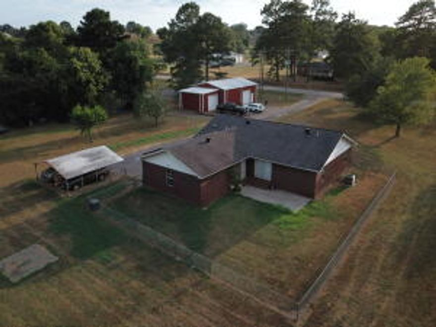 3 Bedroom/2 Bath Home on over 4 Acres! Fenced in Backyard.H&A system is 3 years old.Instant Hot Water System.40x30 Insulated Shop w/1/2 bath and 3 phase electricity in place.There is also a second 16x20 shop.Plenty of Room to have a garden and enjoy all the fruit trees already on the property.How does an $11.00 electric bill sound in the 100-degree weather we are having? The seller is currently paying $11.00 thanks to the solar panels that have been installed. The Warranty Conveys to the new owners as well!