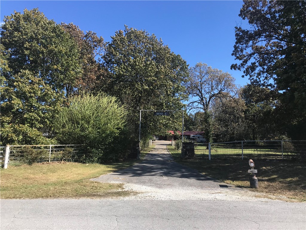 Looking for that horse/hobby farm close to town, here it is. 5 +/- acres with house, several barns and outbuildings. The property is being SOLD AS IS WHERE IS. Remodel this large ranch style house and have a farm just minutes to Springdale, Beaver Lake and 10 minutes to the Interstate.