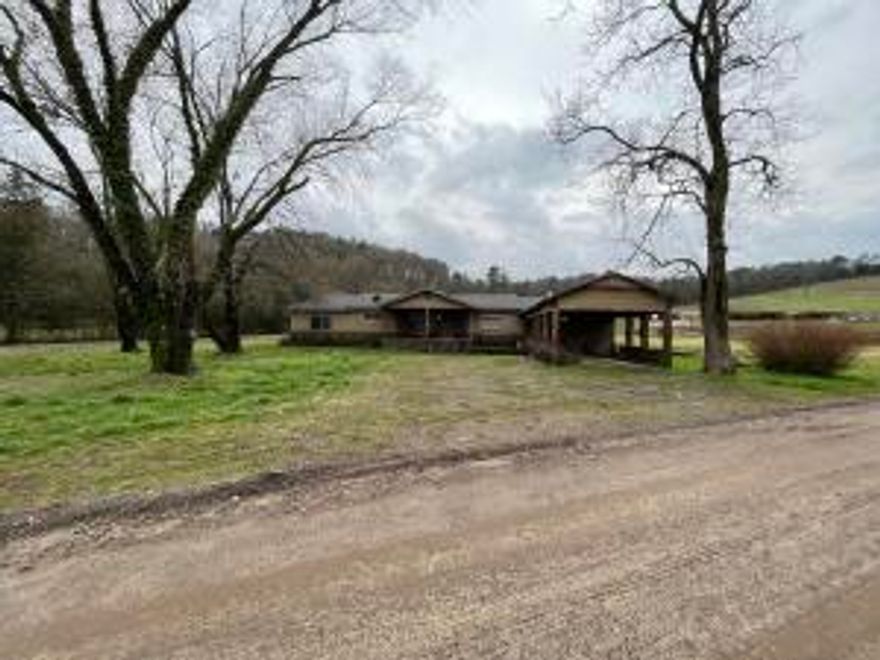 Don't miss out on this opportunity to get 37.5 +/- acres of prime county livin' with a farmhouse to boot! The house is in need of some TLC, but can be beautifully restored with a creative mind. Mill Creek runs beside it, and you will be about a mile away from Big Piney Creek, <10 miles away from Mack's Pines, and <15 minutes from Dover. Call for a showing today!