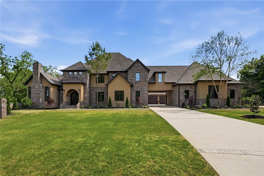 Located at the end of a private driveway, this luxury estate in Talamore sits on 2 large lots totaling 6.5 acres. Surrounded by trees and adjoining the neighborhood pond, there's a strong feeling of seclusion. Inside you'll find elegance, from the wood floors and trim to large windows and sleek, modern design. The spacious layout includes a large living area, office, 5 bedrooms, flex space, and a gorgeous kitchen- thoughtfully designed with a spacious island, dual pantries, and an array of high-end appliances. Unwind in the primary ensuite in the oversized soaking tub and custom dual entry tiled shower. Outdoors, you'll find pristine manicured landscaping, in-ground heated saltwater pool, pool house, and outdoor kitchen ideal for entertaining. The home also includes 3 garage spaces, and an additional heated/cooled bay converted to living space and 1/2 bath. State-of-the-art camera system and whole-home generator add piece of mind. Located close to Coler Mountain Bike preserve, this is luxury living at its best.