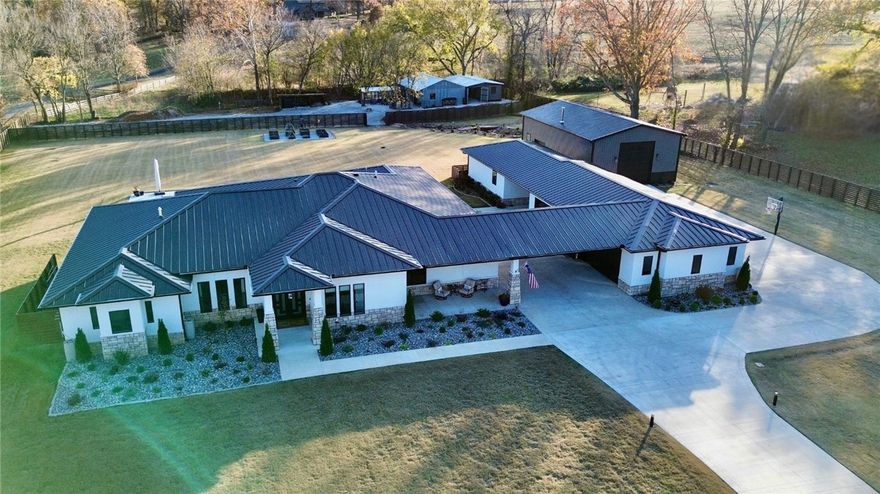 Experience unparalleled luxury and charm in this exquisite one level estate nestled on 2.54 acres. This meticulously maintained home offers 5 spacious bedrooms  4.5 bathrooms and 1 bedroom guest house. You will discover a masterpiece of sophistication and elegance featuring top-tier finishes an open-concept design with soaring ceilings, a chef’s dream kitchen premium appliances, and a luxurious primary suite with a spa-like ensuite. Every corner of this home exudes thoughtful craftsmanship and modern elegance. The outdoor amenities include a gunite swimming pool, patio for entertaining, a  Guest House with a fully-equipped kitchen, bedroom and living area,  a versatile 30x50 (16ft ceiling) Shop Building, along with a  charming custom chicken coop for a touch of country living.
This estate is a rare fusion of luxury and functionality surrounded by natural beauty. Whether hosting gatherings or enjoying tranquil moments this property offers an extraordinary lifestyle. Schedule a private tour