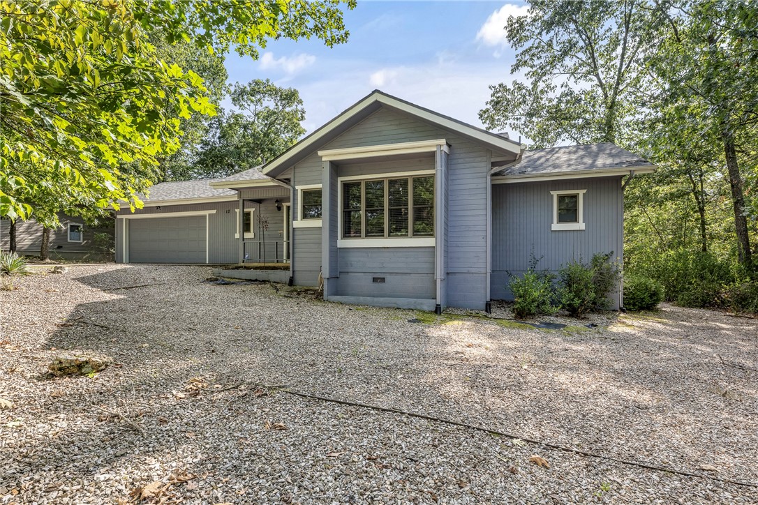 Fall in love with this beautifully maintained 2BR/2BA retreat just moments from Loch Lomond. Step inside to a light-filled eat-in kitchen, a charming heated/cooled sunroom, and a breezy screened porch—perfect for morning coffee or evening sunsets. The spacious backyard invites gatherings, gardening, or simply soaking up the peace and quiet. Recent updates include a new HVAC (2022), roof (2020), fence (2021), interior paint (2020), septic service (2022), and garage door opener (2024). With 5 years of proven short-term rental success, this gem offers the perfect blend of comfort, charm, and investment potential.
