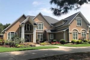 When you arrive at the front gate and drive down the tree lined driveway, you will recognize the true craftsmanship, class, and style of this beautiful home sitting on 7.5 private manicured acres. The main house boast 5 bedrooms, living area with tall ceilings and open balcony, large den with fireplace and cedar ceilings, theater room, and a custom kitchen a master chef would love. The resort-like pool area is a true oasis with a huge water slide and custom rock features. Perfect for entertaining guest with large open space as well as covered outdoor spaces. The detached guest house with kitchenette and bath can also serve as the ultimate man-cave and office area. A 30x40 metal shop is located at the back of the property and offers additional work space and storage.One year home warranty