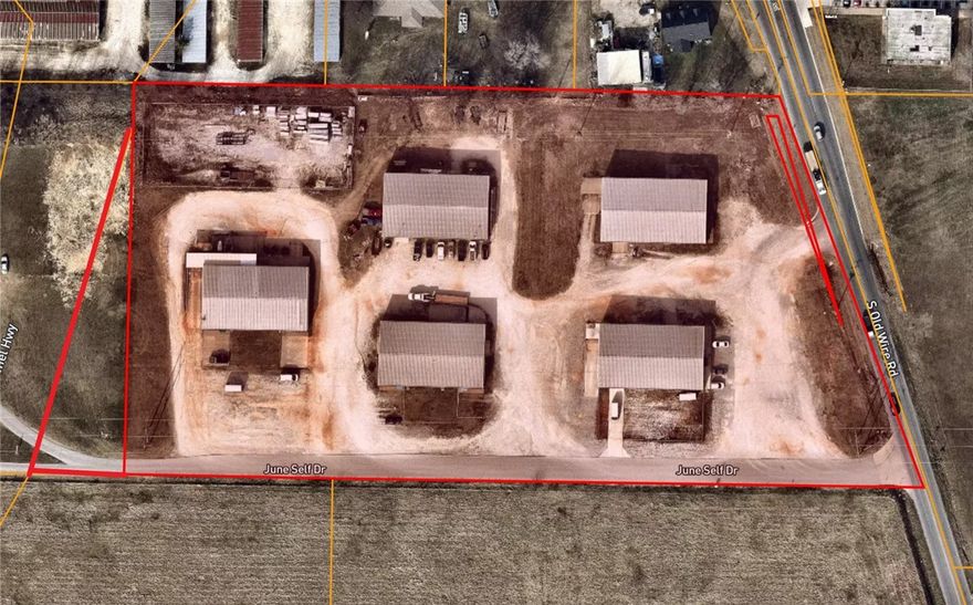 5 Warehouses with office space on 6.22 acres!!! property is conveniently located right off the corner of Hwy 264/Hwy 265 in Springdale. Property spans across from Hwy 265 to Old Wire Rd which gives multiple accesses to this property. All warehouses are currently leased. Along with the warehouses, there is a fenced in area that would be great for securing property and vehicles. All warehouses have overhead garage doors for easy access for loading and office areas. This would make a great investment. Come check out this property before it is sold!