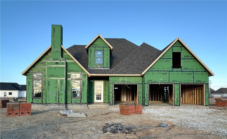 Welcome to County Line Square, a new Springdale community near Shaw Family Park with a pool and pavilion. Upon entry, the living room sits just to the left and features a vaulted ceiling, a brick fireplace, and engineered hardwood floors that extend throughout the first floor. This space opens into the dining and kitchen area, where sliding glass doors lead to the covered back patio. The kitchen includes a large island, quartz countertops, cabinets to the ceiling, GE Profile stainless steel appliances, and a pantry. Down the hallway, you’ll find access to the 3-car garage, the laundry room, a guest bedroom, a full bathroom. The primary suite is also on the main level and features a vaulted ceiling, along with a bathroom that includes a double vanity and centered makeup vanity, a walk-in shower, and a walk-in closet. Upstairs offers 3 additional bedrooms and a full bathroom. A fence, blinds, and gutters are included. Builder’s preferred lender is offering $3500 toward closing costs or a rate buy down. *Agent Owned*