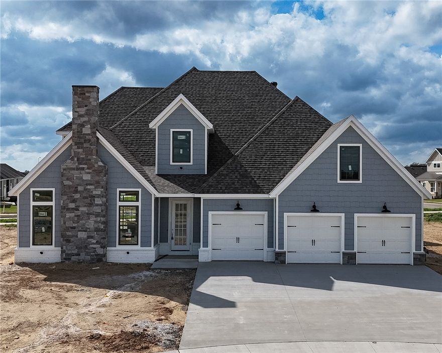 Welcome to County Line Square, a new Springdale community near Shaw Family Park with a pool and pavilion. Upon entry to the Glenwood, the living room sits just to the left and features a vaulted ceiling, a brick fireplace, and engineered hardwood floors that extend throughout the first floor. This space opens into the dining and kitchen area, where sliding glass doors lead to the covered back patio. The kitchen includes a large island, cabinets to the ceiling, GE Profile stainless steel appliances, and a pantry. Down the hallway, you’ll find access to the 3-car garage, the laundry room, a guest bedroom, a full bathroom. The primary suite is also on the main level and features a vaulted ceiling, along with a bathroom that includes a double vanity and centered makeup vanity, a walk-in shower, and a walk-in closet. Upstairs offers 3 additional bedrooms and a full bathroom. A fence, blinds, and gutters are included. Builder’s preferred lender is offering $3500 toward closing costs or a rate buy down. *Agent Owned*
