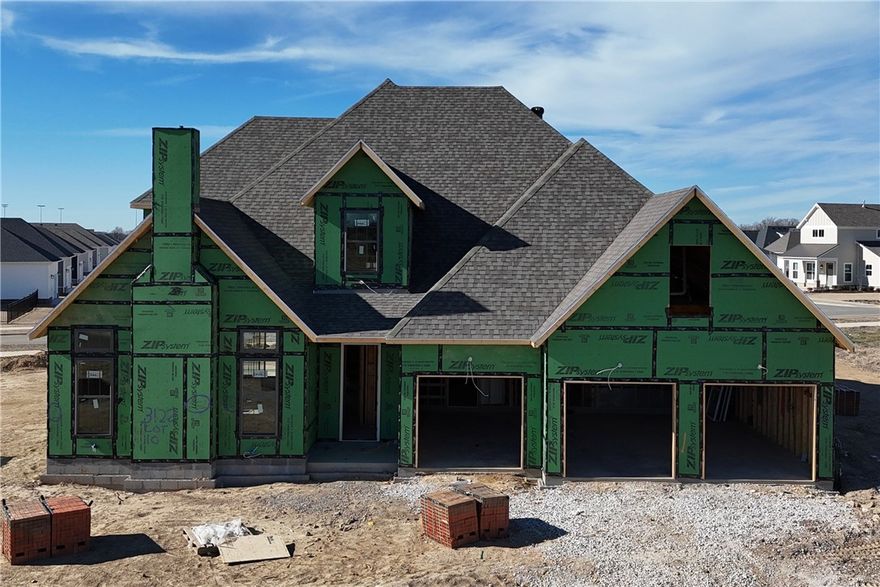 Welcome to County Line Square, a new Springdale community near Shaw Family Park with a pool and pavilion. Upon entry, the living room sits just to the left and features a vaulted ceiling, a brick fireplace, and engineered hardwood floors that extend throughout the first floor. This space opens into the dining and kitchen area, where sliding glass doors lead to the covered back patio. The kitchen includes a large island, quartz countertops, cabinets to the ceiling, GE Profile stainless steel appliances, and a pantry. Down the hallway, you’ll find access to the 3-car garage, the laundry room, a guest bedroom, a full bathroom. The primary suite is also on the main level and features a vaulted ceiling, along with a bathroom that includes a double vanity and centered makeup vanity, a walk-in shower, and a walk-in closet. Upstairs offers 3 additional bedrooms and a full bathroom. A fence, blinds, and gutters are included. Builder’s preferred lender is offering $3500 toward closing costs or a rate buy down. *Agent Owned*