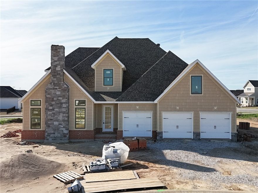 Welcome to County Line Square, a new Springdale community near Shaw Family Park with a pool and pavilion. Upon entry to the Glenwood, the living room sits just to the left and features a vaulted ceiling, a brick fireplace, and engineered hardwood floors that extend throughout the first floor. This space opens into the dining and kitchen area, where sliding glass doors lead to the covered back patio. The kitchen includes a large island, cabinets to the ceiling, GE Profile stainless steel appliances, and a pantry. Down the hallway, you’ll find access to the 3-car garage, the laundry room, a guest bedroom, a full bathroom. The primary suite is also on the main level and features a vaulted ceiling, along with a bathroom that includes a double vanity and centered makeup vanity, a walk-in shower, and a walk-in closet. Upstairs offers 3 additional bedrooms and a full bathroom. A fence, blinds, and gutters are included. Builder’s preferred lender is offering $3500 toward closing costs or a rate buy down. *Agent Owned*