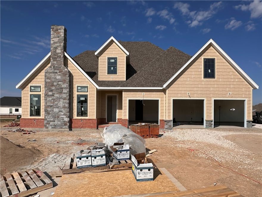 Welcome to County Line Square, a new Springdale community near Shaw Family Park with a pool and pavilion. Upon entry to the Glenwood, the living room sits just to the left and features a vaulted ceiling, a brick fireplace, and engineered hardwood floors that extend throughout the first floor. This space opens into the dining and kitchen area, where sliding glass doors lead to the covered back patio. The kitchen includes a large island, cabinets to the ceiling, GE Profile stainless steel appliances, and a pantry. Down the hallway, you’ll find access to the 3-car garage, the laundry room, a guest bedroom, a full bathroom. The primary suite is also on the main level and features a vaulted ceiling, along with a bathroom that includes a double vanity and centered makeup vanity, a walk-in shower, and a walk-in closet. Upstairs offers 3 additional bedrooms and a full bathroom. A fence, blinds, and gutters are included. Builder’s preferred lender is offering $3500 toward closing costs or a rate buy down. *Agent Owned*