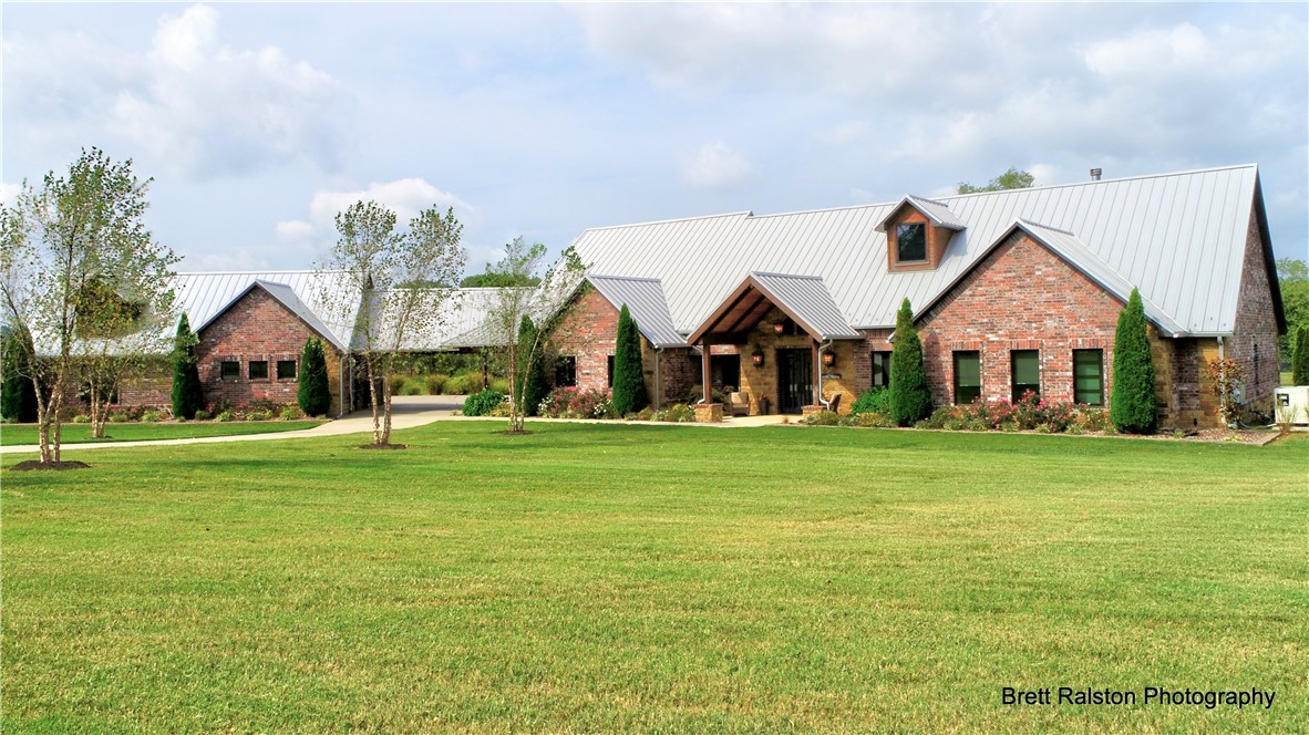 Incredible 20 Acre III Waters Custom Estate available in Bentonville!! Stunning 5720 Sq. ft. Rocky Mountain style home w/high quality construction throughout. This one level home was designed w/ every detail in mind. 3 bedrooms, 2.5 baths, gorgeous oak heated floors, 3 fireplaces, structural steel beams w/natural rust finish, Huge pantry, wine cellar, large screen porches & the most peaceful views of the 1 acre spring fed pond w/fountain. Huge master closet doubles as storm shelter. High end appliances including steam & convection ovens. Whole house water filtration system. Top of the line 3 car heated/cooled garage w/polished floors, vehicle lift, air compressor, central vac & double layer frosted glass doors. Beautiful barn includes ~800 sq, ft. of finished space, also heated/cooled. Zip system metal roof, RV parking on site, whole house generator & control 4 smart system. Beautiful property also includes spring fed swimming hole AND Little Osage Creek running through the backyard. This is truly one of a kind.