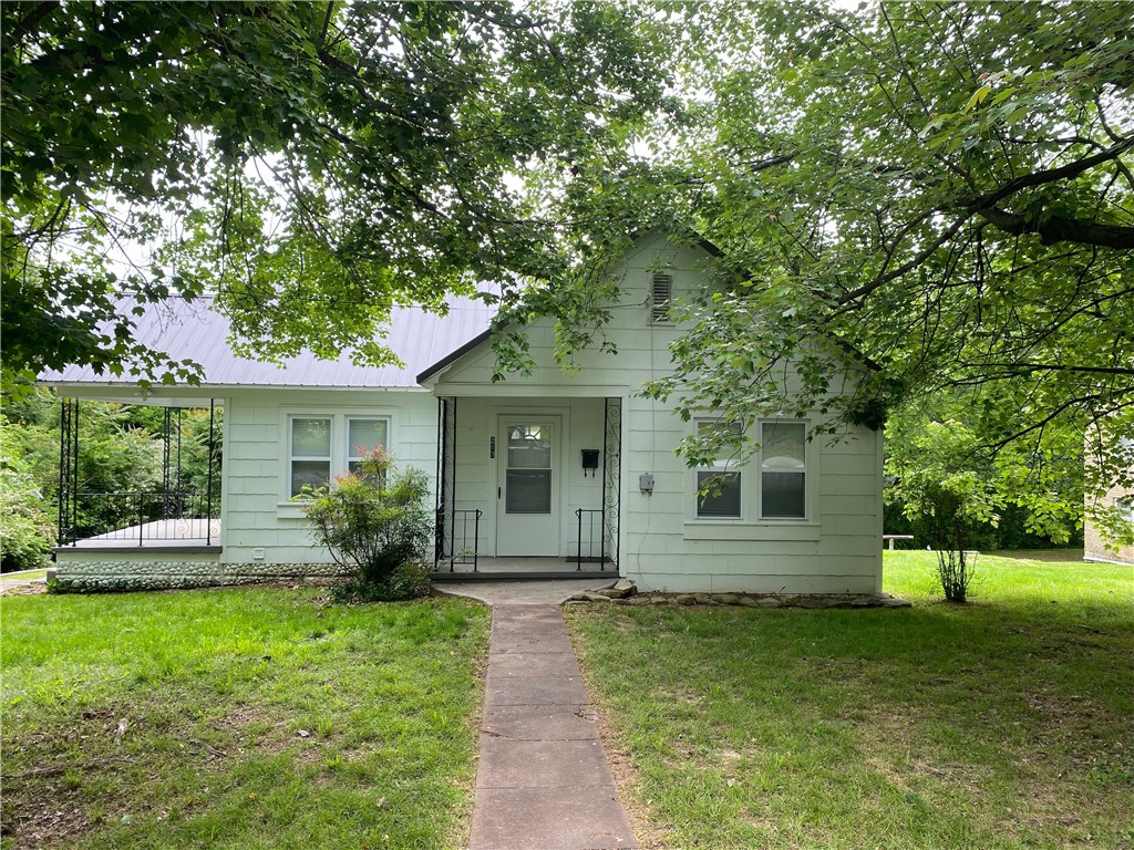 Really cute cottage style, home in terrific condition with 2BR 1BA, metalroof, basement with a garage. Basement area about 532 sqft. Covered patio on north side of house, painted asbestos siding. Must see!
