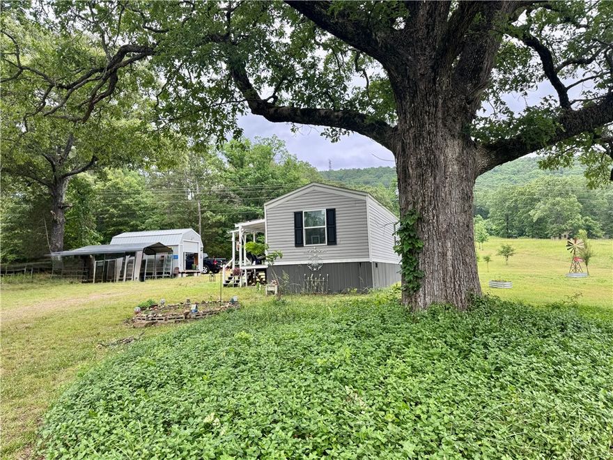 Warm, welcoming, and full of charm, this beautifully maintained 840 SF single wide mobile home sits on a permanent foundation and offers peaceful country living on two manicured acres complete with a pond. Inside, you’ll find a custom kitchen filled with character and functionality, along with two spacious bedrooms and two full baths designed for comfort and convenience. A cozy covered front porch creates the perfect place to enjoy your morning coffee, while the attached enclosed outdoor space offers endless possibilities for relaxing, hobbies, entertaining, or simply extra room to spread out. Thoughtfully equipped with a generator for peace of mind during power outages, this property combines comfort, practicality, and a truly homey atmosphere. Whether you’re looking to downsize, enjoy a slower pace, or find your own little slice of country paradise, this one is sure to steal your heart. Contact me today to discuss financing options and schedule your private showing!