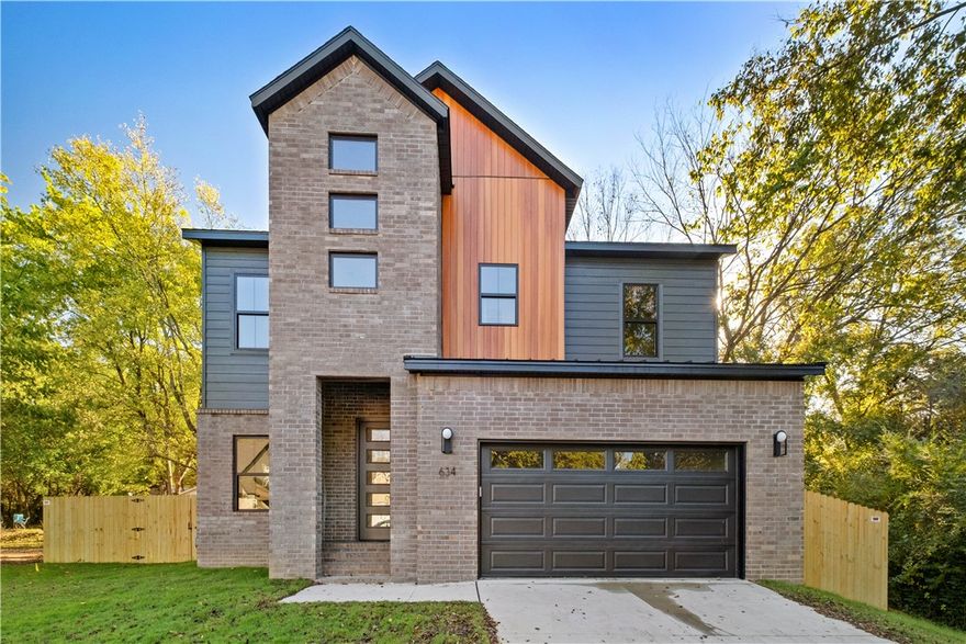 Up to $5,000 in concessions from the builder and builder partners with an acceptable offer and qualified buyer. Preferred lender options available upon request. Brand-new construction along desirable Happy Hollow Road! This thoughtfully designed 3-bedroom, 2.5-bath home includes a dedicated office and showcases quality finishes throughout. Enjoy all solid-surface flooring—luxury vinyl plank and tile, plus sleek quartz countertops. The open-concept layout connects the kitchen, dining, and living areas for everyday living and entertaining. Nestled outside of any subdivision, this property offers a rare sense of freedom and privacy while being just minutes from the University of Arkansas, Downtown Fayetteville, and the city’s best trails, parks, and dining. A perfect blend of modern comfort and prime location—waiting for you to call it home!