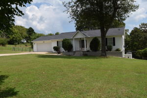 Ready to move in! Beautiful kitchen with granite countertops. Spacious main level master. Bamboo hardwoods and tile throughout the main level. Huge family room located in the walkout basement. Fenced in yard with storage building. House has propane generator, security system, water softener. Convenient to everything, just a short distance from town on 3/4 acre.