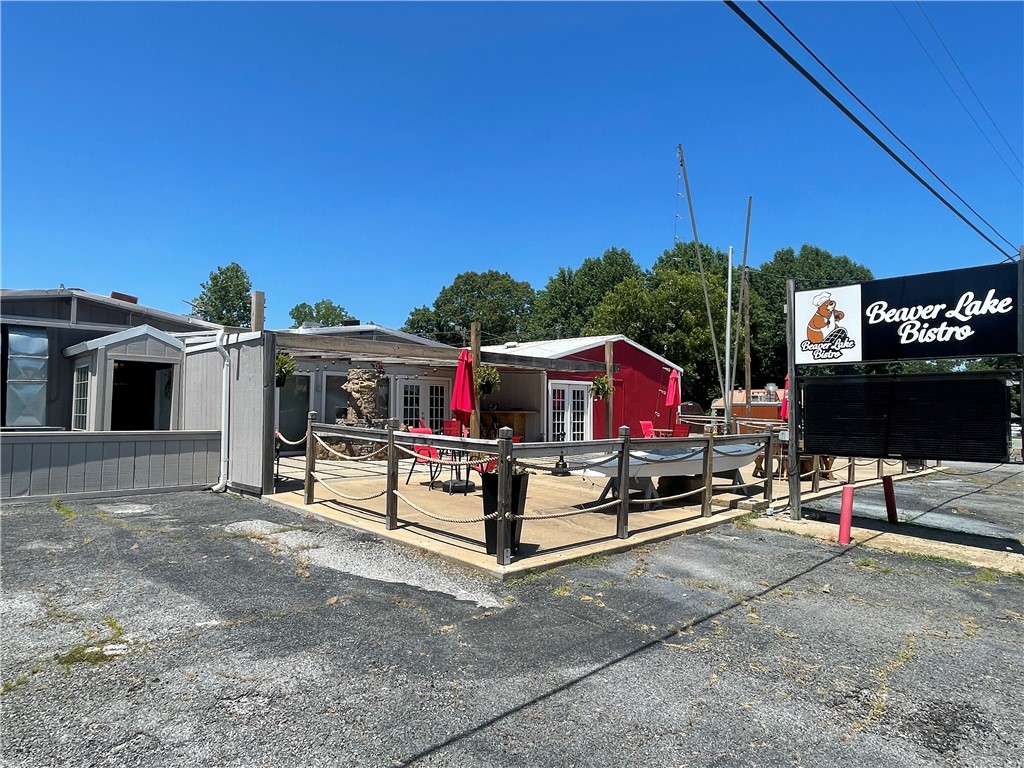 Local restaurant in heart of Prairie Creek. Close to marina/boat ramp, and located on Highway 12 with heavy traffic. Multiple dining spaces, patio seating area, large parking lot, fully equipped kitchen, bar area. Close to golf, country club, and just minutes from Downtown Rogers. Major road frontage of 150 +/- ft on Highway 12! Liquor license, equipment, and furniture to convey. Coin operated machines do not convey.