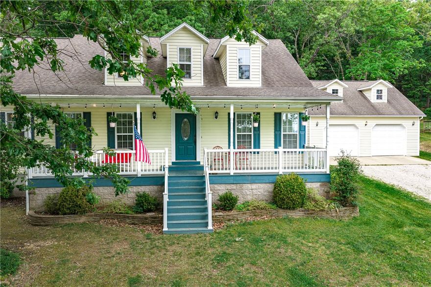 Absolutely beautiful and full of country charm! This 4 bedroom, 3 bath home, sitting on 13.1 acres on the outskirts of Berryville, was built and maintained with attention to detail. You will fall in love with the beautiful and updated kitchen that boasts lots of storage, stainless appliances, hardwood floors, granite countertops, a walk-in pantry, and a built-in coffee bar. The living room is warm and inviting with a corner gas log fireplace. You will find the Lg. primary bedroom and bath, 2 guest bedrooms, a guest bath, and laundry all located on the main level. Upstairs you will find another spacious bedroom, a den/game room, and another full bath. The exterior of this home is fantastic also with an outdoor fireplace & hot tub on the rear deck, covered front porch to enjoy and mature hardwood trees. There's also a bonus room above the detached garage to make what you like and metal carport to cover extra toys. Schedule your showing today before it's gone.